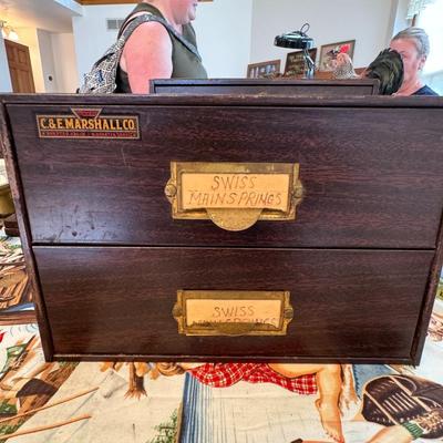 C & E case full of Swiss watch parts