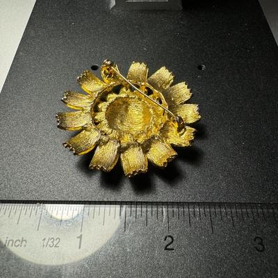 Metal flower brooch