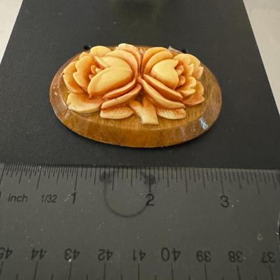 carved brooch