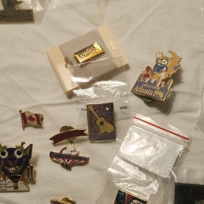 Vintage buttons and pins including Wichita river festival the greeting