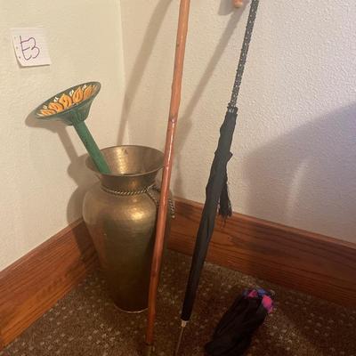 E3-Umbrellas, cane, garden bath in a large vase