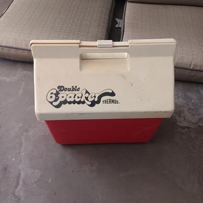 3 PATIO CHAIR CUSHIONS AND A COOLER