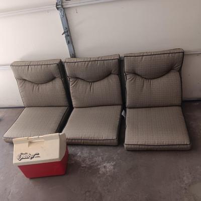 3 PATIO CHAIR CUSHIONS AND A COOLER