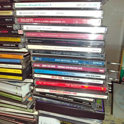 Collection of CDs, DVDs, and VHS