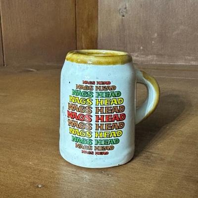 A Collection of Ohio Trinkets, Marbles, Rockingham Glaze Mug and Other Items