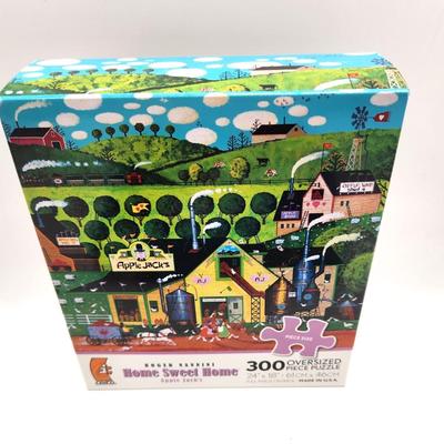 Lot #132L Lot of 3 factory sealed Jigsaw puzzles