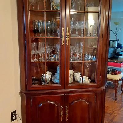 Thomasville Cherry lighted corner cabinet with glass shelves