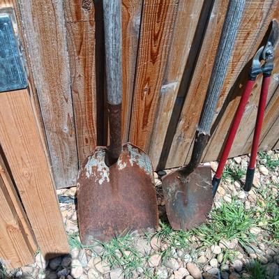 NICE PICK AXE, SAWHORSE LEGS, SPUD BAR, SHOVELS AND LOPERS