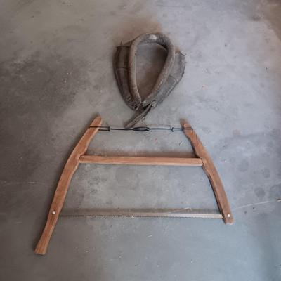 LEATHER HORSE COLLAR & AN ANTIQUE BUCK SAW