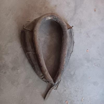 LEATHER HORSE COLLAR & AN ANTIQUE BUCK SAW