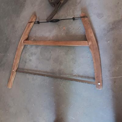 LEATHER HORSE COLLAR & AN ANTIQUE BUCK SAW