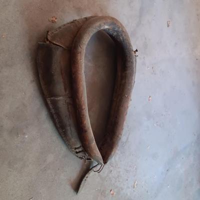 LEATHER HORSE COLLAR & AN ANTIQUE BUCK SAW