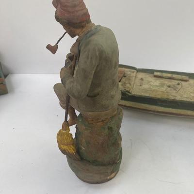 Antique carved Shipwrecked boat and fisherman figure with framed boat artwork