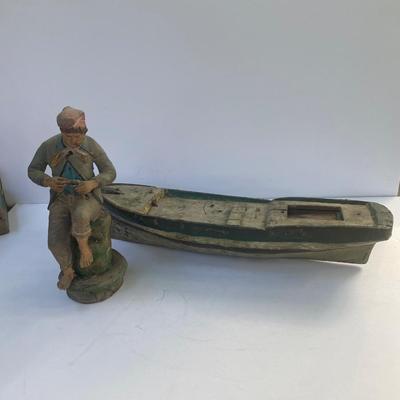 Antique carved Shipwrecked boat and fisherman figure with framed boat artwork