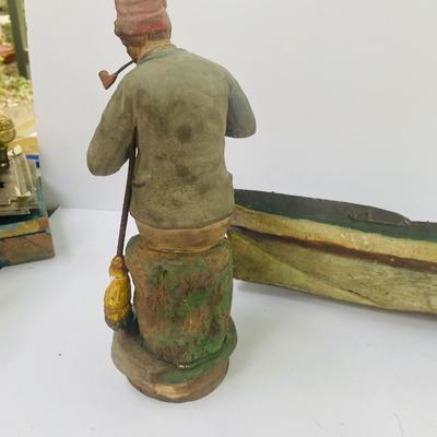 Antique carved Shipwrecked boat and fisherman figure with framed boat artwork
