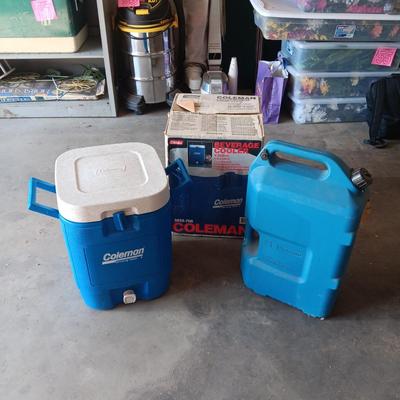 LIKE NEW COLEMAN BEVERAGE COOLER AND A 5 GALLON WATER CONTAINER
