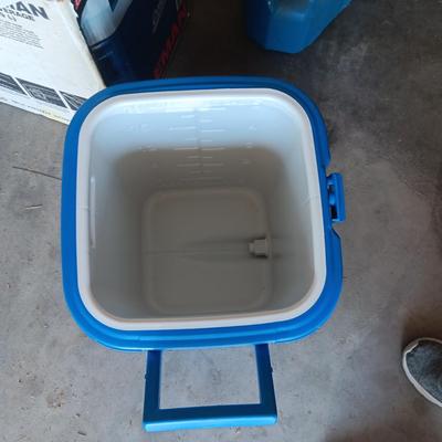 LIKE NEW COLEMAN BEVERAGE COOLER AND A 5 GALLON WATER CONTAINER