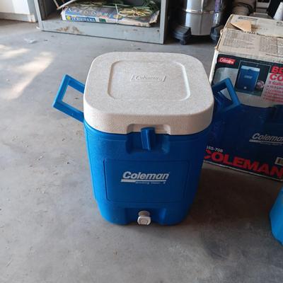 LIKE NEW COLEMAN BEVERAGE COOLER AND A 5 GALLON WATER CONTAINER