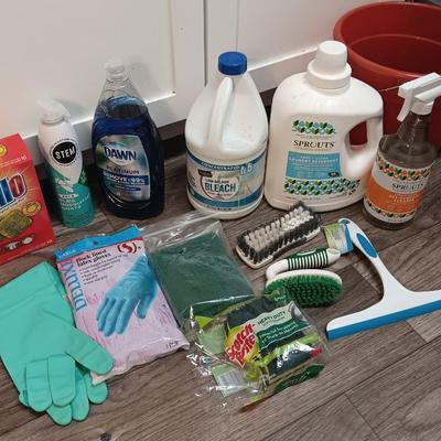 Cleaning products and cleaning tools with a mop bucket and new rubber gloves
