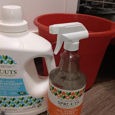 Cleaning products and cleaning tools with a mop bucket and new rubber gloves