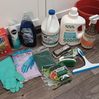 Cleaning products and cleaning tools with a mop bucket and new rubber gloves