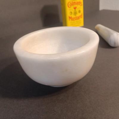 Mortar and Pestle white Marble with an empty Colman's mustard tin