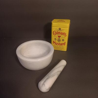 Mortar and Pestle white Marble with an empty Colman's mustard tin