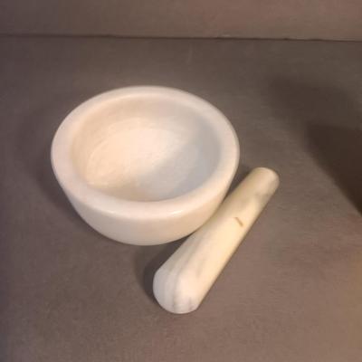 Mortar and Pestle white Marble with an empty Colman's mustard tin
