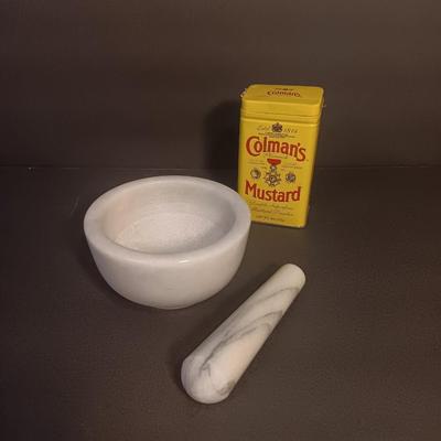 Mortar and Pestle white Marble with an empty Colman's mustard tin