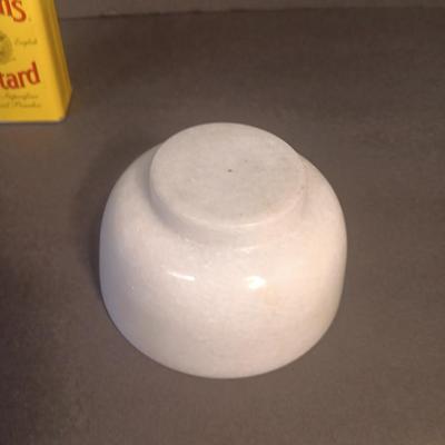Mortar and Pestle white Marble with an empty Colman's mustard tin