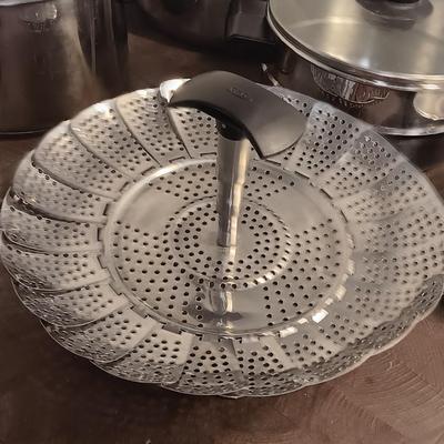 Stainless steel pots and pans with a stainless steel steamer