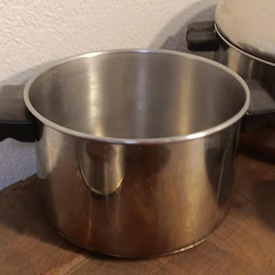 Stainless steel pots and pans with a stainless steel steamer