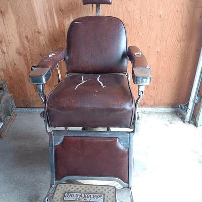 Antique barber chair with attached razor strap