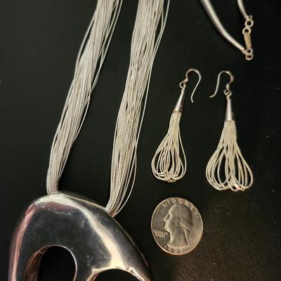 Multi strand liquid silver necklace with pendant, and earrings