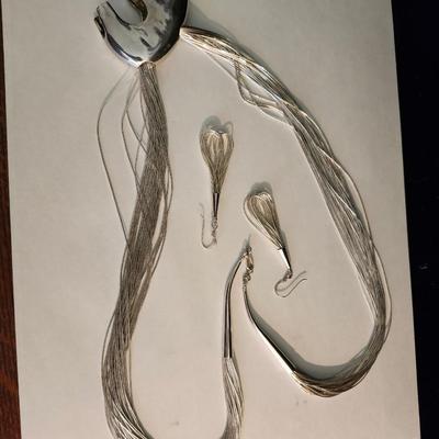 Multi strand liquid silver necklace with pendant, and earrings