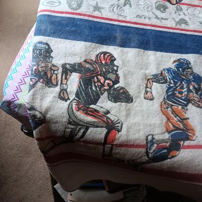TWIN SIZE NFL FOOTBALL BLANKET AND JOHN ELWAY ON A BOX OF SEALED WHEATIES CEREAL