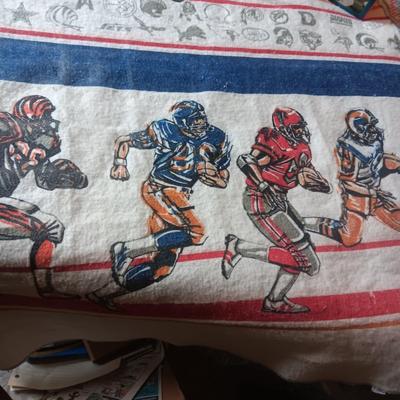 TWIN SIZE NFL FOOTBALL BLANKET AND JOHN ELWAY ON A BOX OF SEALED WHEATIES CEREAL