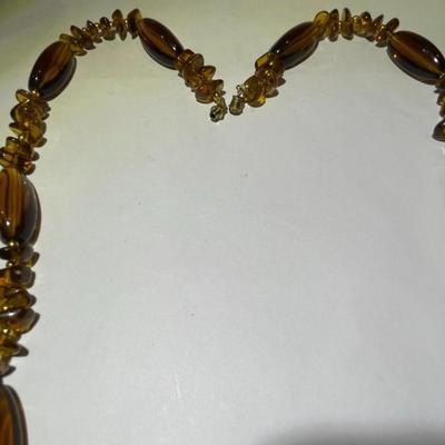 Vintage Mid-Century Amber Color Resin/Lucite Necklace 30" Long in Good Preowned Condition.