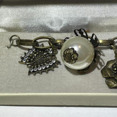 Vintage Mid-Century Antiqued Brass Charm Bracelet by Decade with Miscellaneous Charms as Pictured.