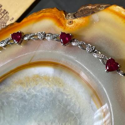 Sterling Silver .925 Dainty Heart Shaped Red Stones Bracelet 7-1/2" Long in VG Condition.