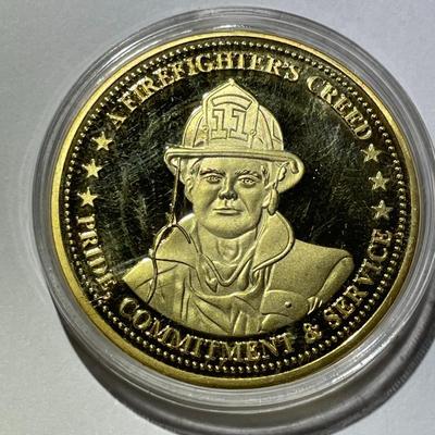 A Firefighter's Creed Commemorative Coin Encircled by the creed "Pride, Commitment & Service w/Firefighter's Emblem on...