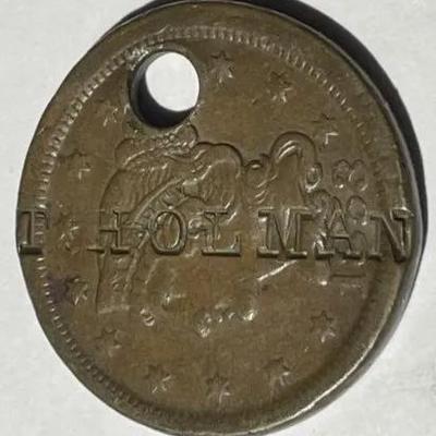 1853 (T. HOLMAN) COUNTERSTAMPED & HOLED LARGE CENT FOR PENDANT AS PICTURED.