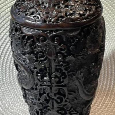 Vintage Chinese Black/Brown Carved Cinnabar 8.5" Tall Dragon Vase w/Wooden Stand in VG Preowned Condition.