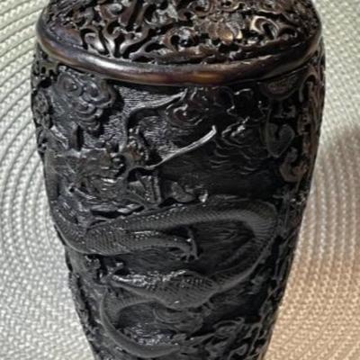 Vintage Chinese Black/Brown Carved Cinnabar 8.5" Tall Dragon Vase w/Wooden Stand in VG Preowned Condition.