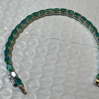 Vintage Simulated Emerald Tennis Bracelet in Sterling Silver 7.25" Long in Good Preowned Condition.