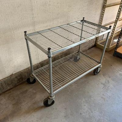 2 TIER METAL CART ON CASTERS AND 2 SMALLER PLASTIC SHELVES