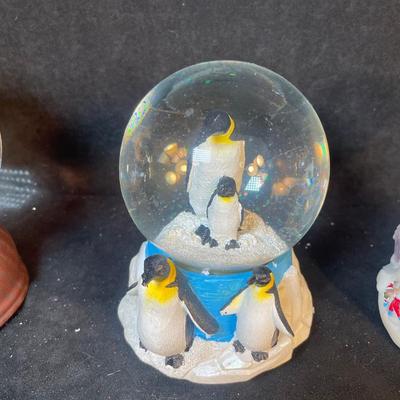Lot 162. Three Snow Globes