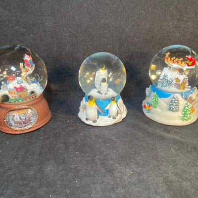 Lot 162. Three Snow Globes
