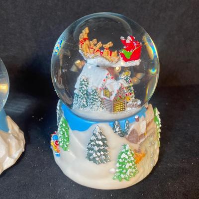 Lot 162. Three Snow Globes