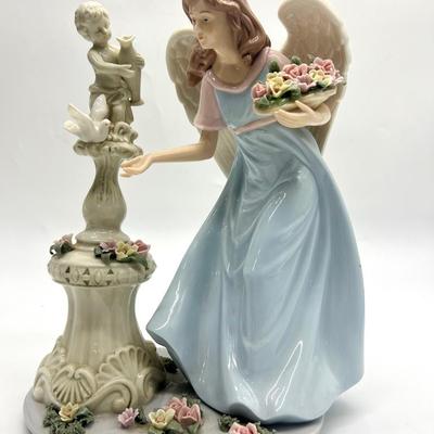 Porcelain Angel With Cherub Statue